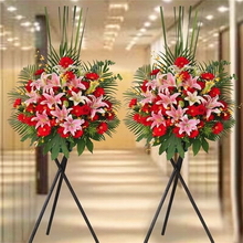 Multi-bloom Pink Lilies, Red Gerbera Daisies, Assorted Foliage in Tripod Basket