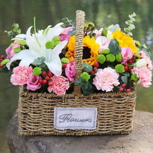 19 Stems of Pink Carnations, 2 Stems of Sunflowers & 1 Stem of Multi-bloom White Lily in a Handled Basket
