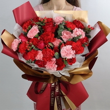 9 Stems of Pink Carnations, 9 Stems of Red Carnations, 9 Stems of Red Roses, Hypericum Berries, and Eucalyptus