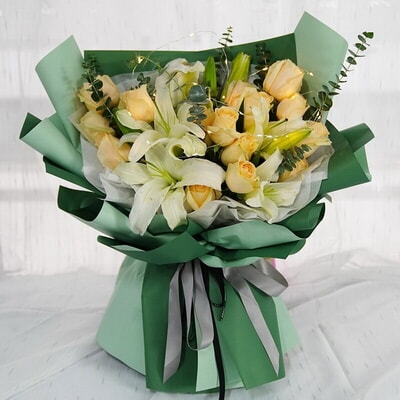 19 Stems of Champagne Roses, 2 Stems of Multi-bloom White Lilies, LED Lights