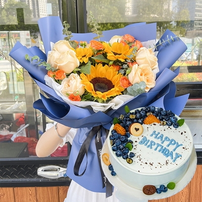 8 Stems of Champagne Roses, 3 Stems of Sunflowers & Round Fruit Cake